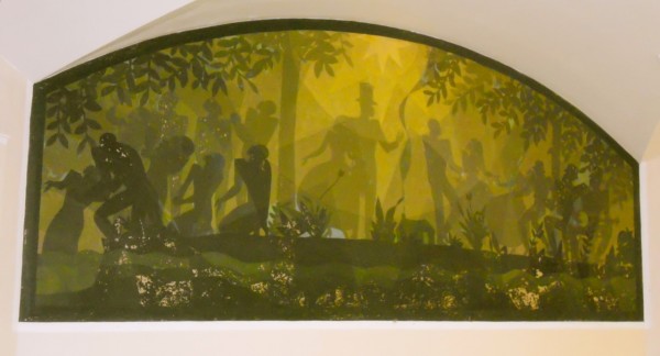 Several shadowy, green-tinted silhouettes of people gather among trees and foliage in Harlem, New York, with sunlight filtering through leaves.