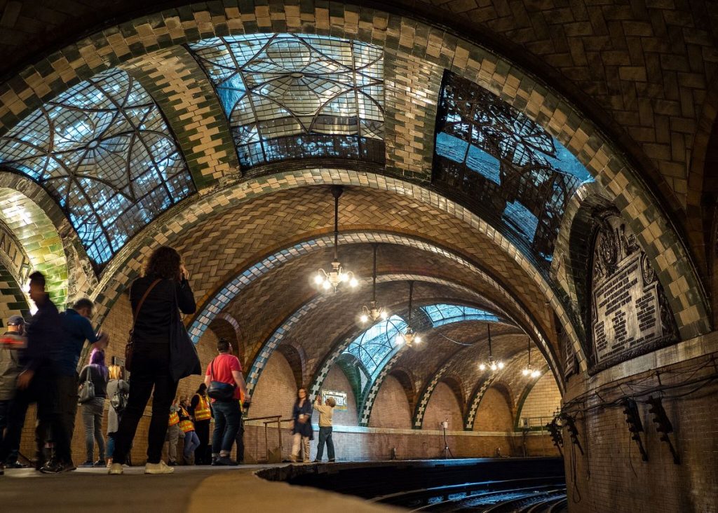 People taking pictures inside one of the secret places in NYC, City Hall subway station.