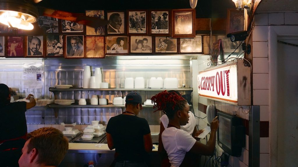 People inside a restaurant working. Thsi shows the interior of Florida Avenue Grill, the oldest soul food restaurant in DC