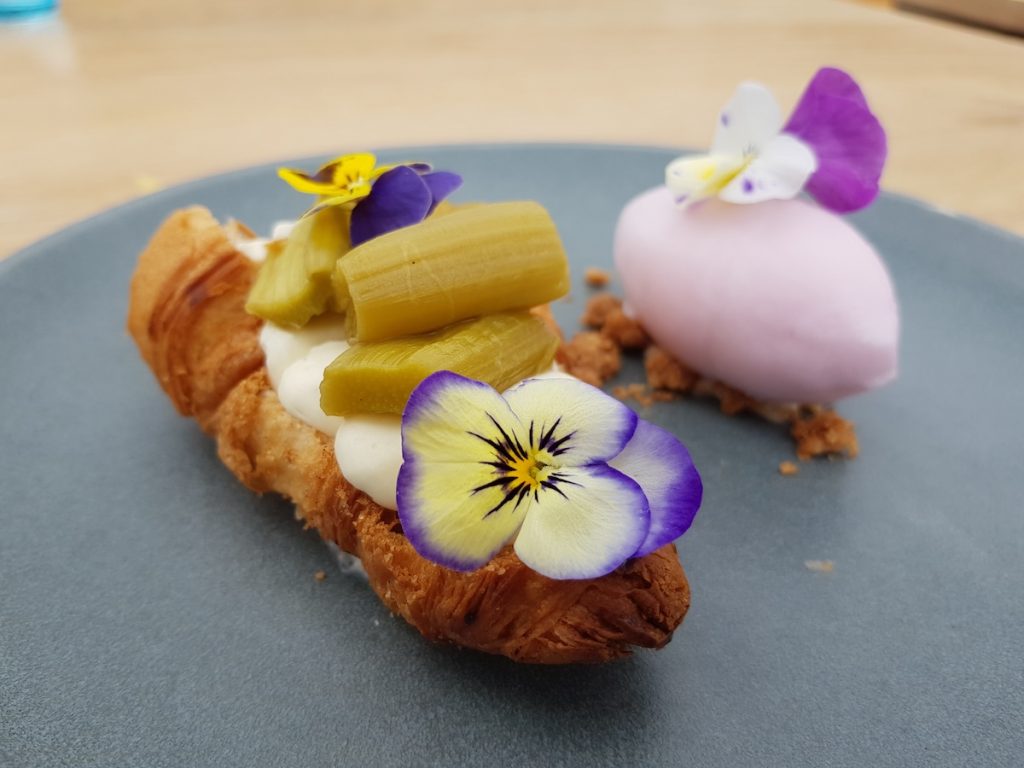 An example of modern Amsterdam food—rhubarb desserts with edible flowers.