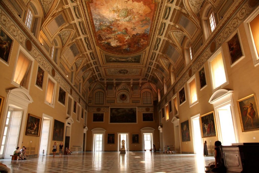 People walking around the main hall of the Archeology Museum in Naples. Photo credit: