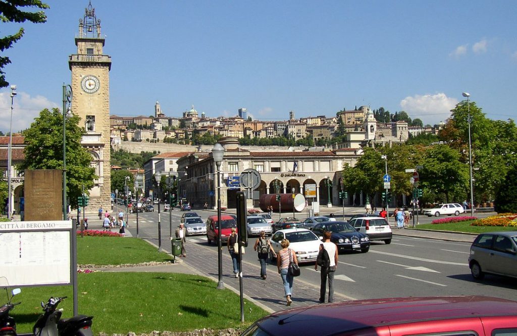 People waling near a park in Citta' Bassa, Bergamo.