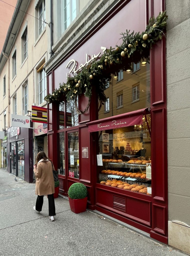 A woman walking by François Pralus in France.