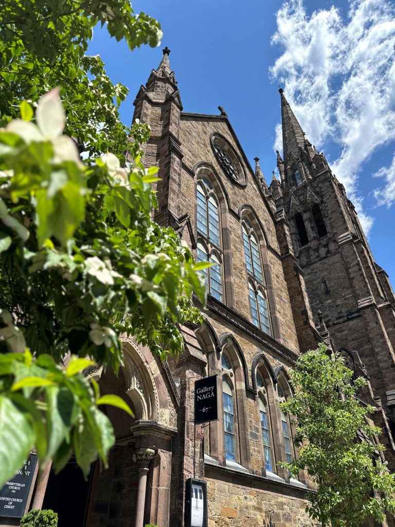 image of large church with greenery out front - Gallery Naga, one of the Boston Art Galleries recommended for art lovers.