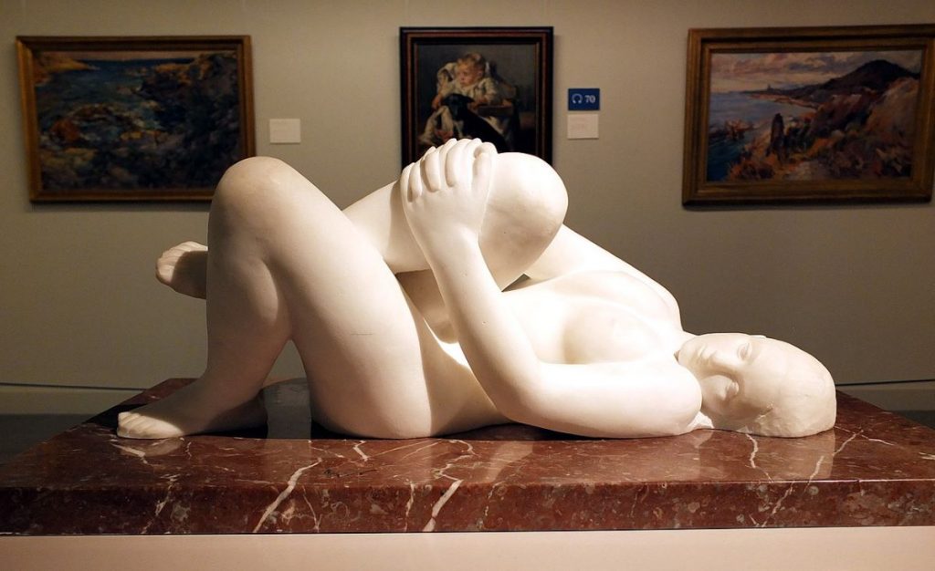 A statue of a person laying down at the Montserrat Museum.