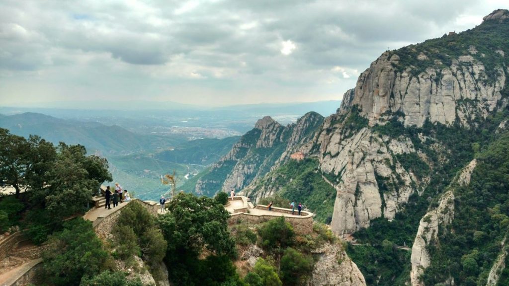 People walking up to a viewpoint at Montserrat, Spain.