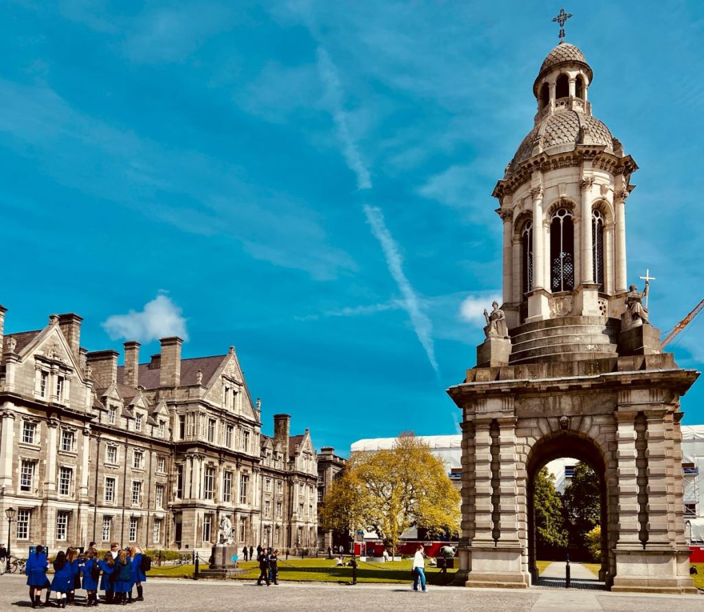 People walking around Trinity College in Dublin.