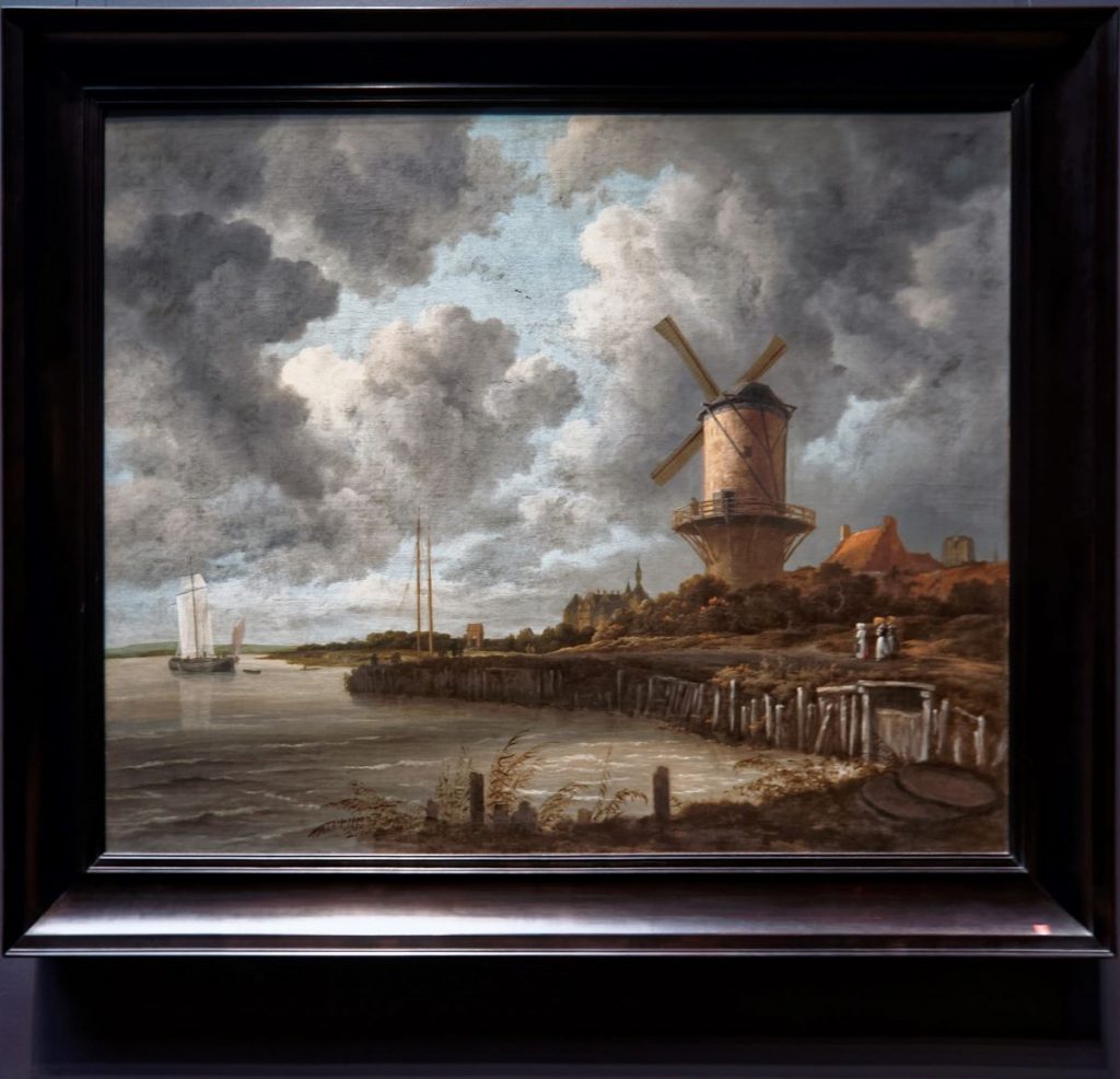 A Ruisdael, Windmill at Wijk bij Duurstede painting hanging on the wall.