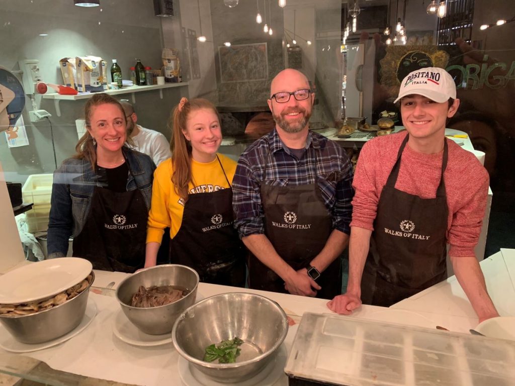 Amy and her family taking a pasta class in Rome provided by Take Walks Tours.