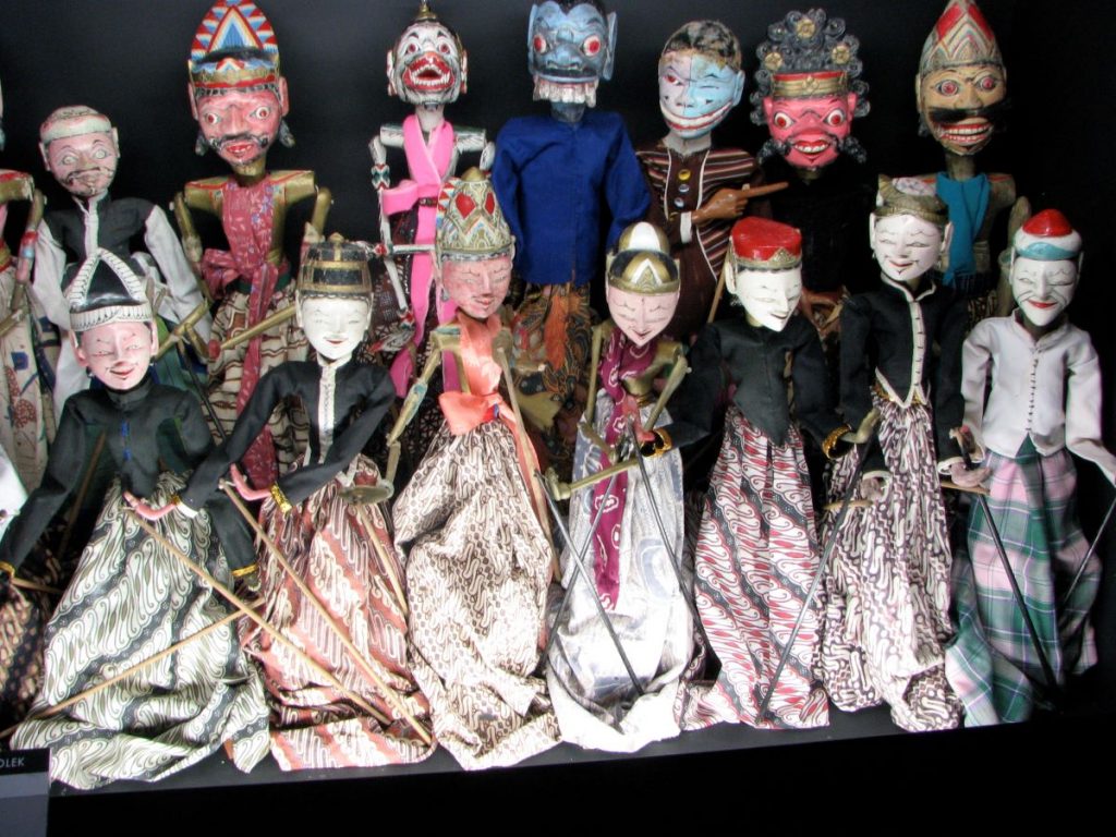14 different puppets, in different styles and colours lined up as an exhibit in the Museum of Puppetry, one of the most unusual museums in Lisbon