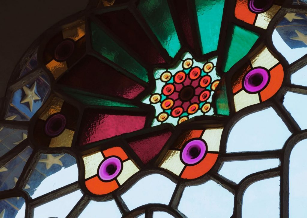 A stained glass window at the Bellesguard, one of the unusual things to do in Barcelona, Spain.