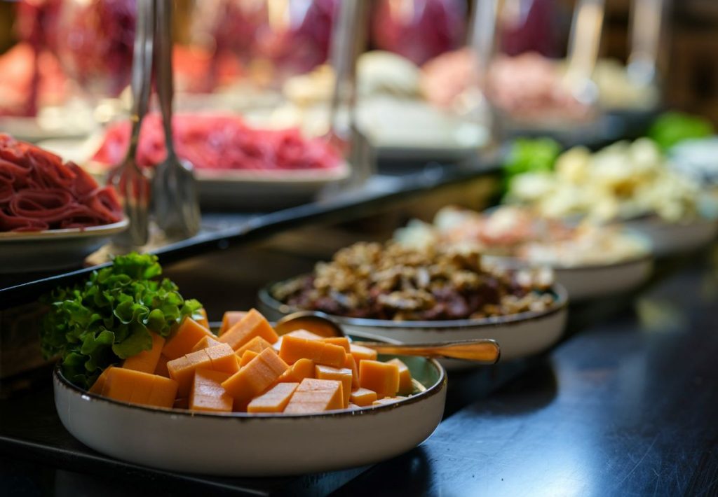 A row of food at a buffet