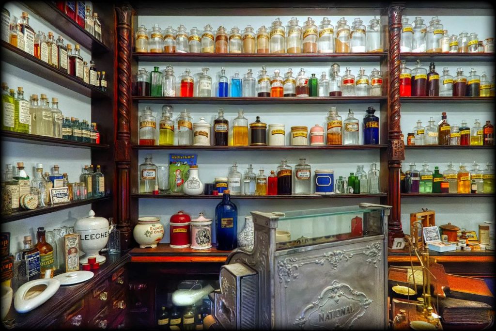 Old medicine bottles sitting on a shelf at the Apothecary Museum.