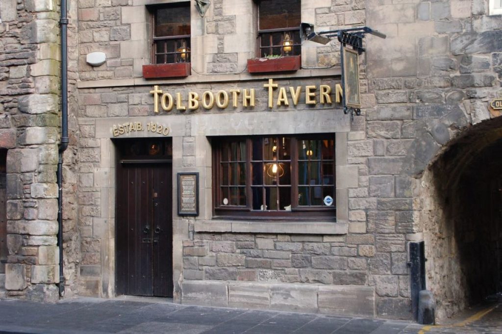 stone building with Tolbooth Tavern sign