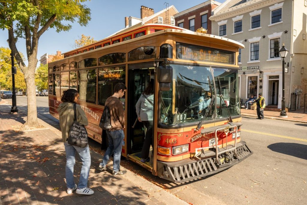 People getting on a trolley in Alexandria, Virginia.
