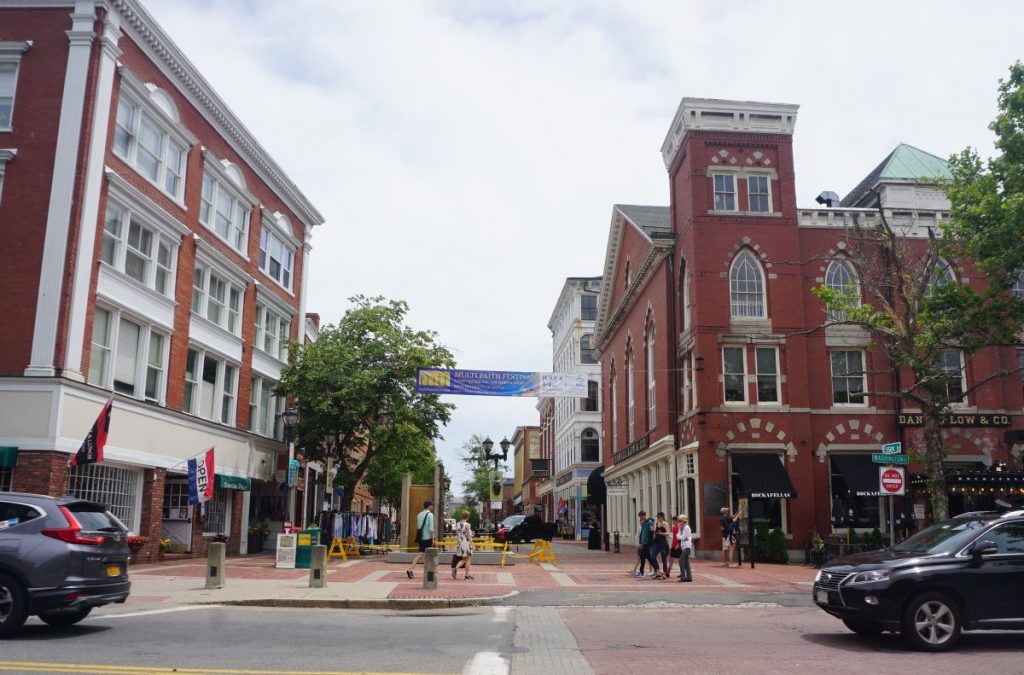 People walking in front of haunted places in Salem.