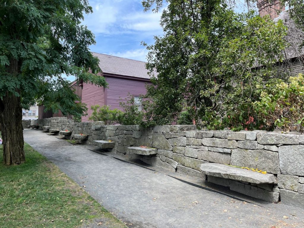 The Welcome Center grounds of the Charter Street Cemetery.